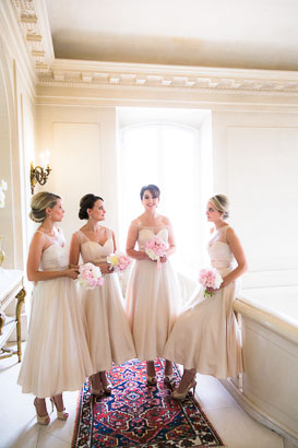 Bridesmaids with bouquets in French Chateau