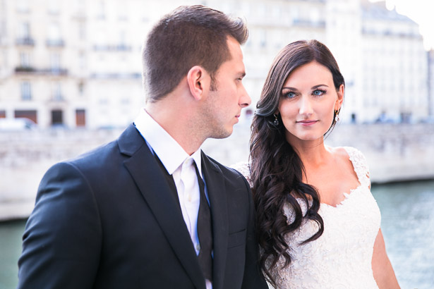 Blue-eyed bride looking at groom
