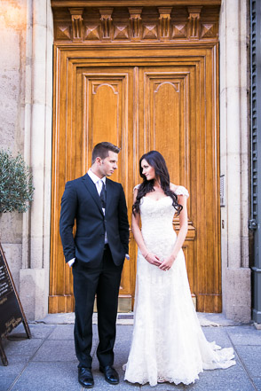 Wedding couple in front of beautiful Parisian door
