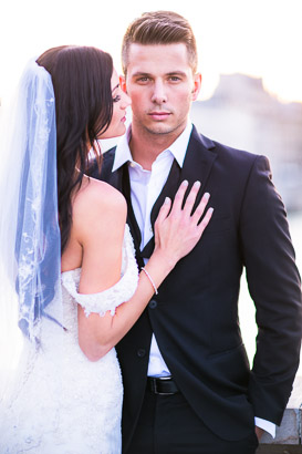 Wedding portrait with bridal veil and handsome groom
