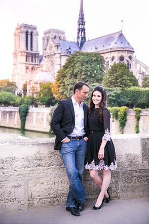 Notre Dame Paris in sunshine behind engaged couple