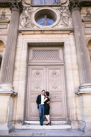 Couple in front of large doors at Le Louvre
