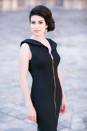Woman in zip front black dress