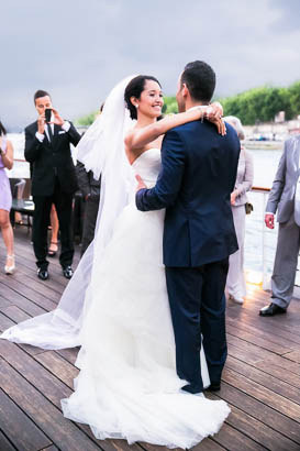Groom Holds Bride During Elopement Ceremony on Paris River Cruise
