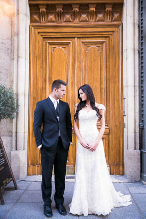 Bride Standing Close to Groom in Front of Paris Door