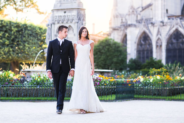 Bride and Groom Walk in Flower Garden of Notre Dame