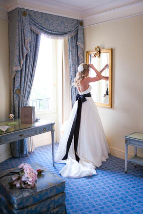 Bride Getting Ready in Front of Mirror