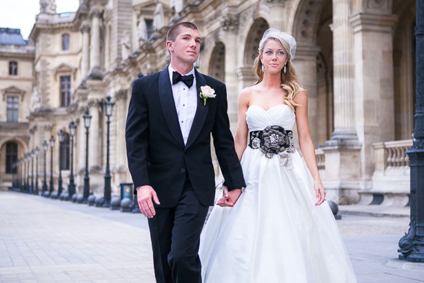 Groom and Bride Walking Along Row of Louvre Lamp Posts