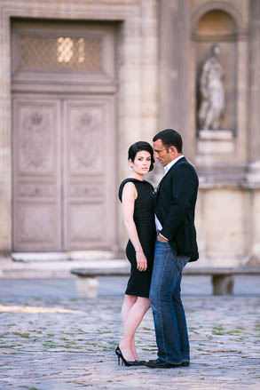 Couple Standing in Courtyard of Le Louvre