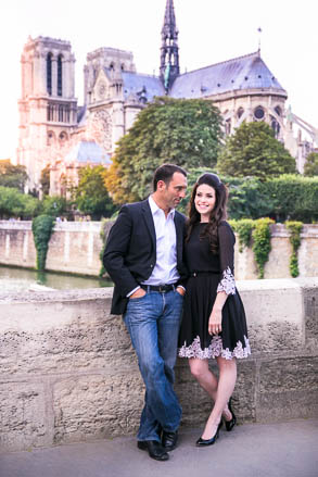 Sun Setting on Notre Dame Behind Engaged Couple
