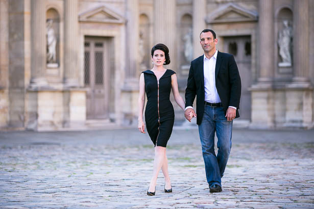 Engaged Couple Walks in Louvre Courtyard