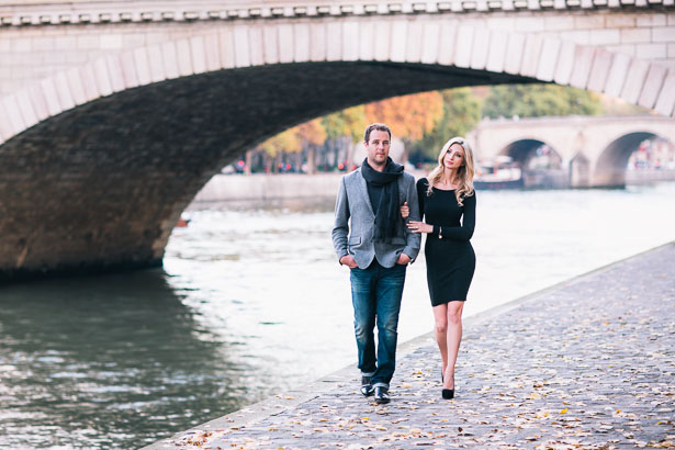 Engaged Couple Strolls Along Seine