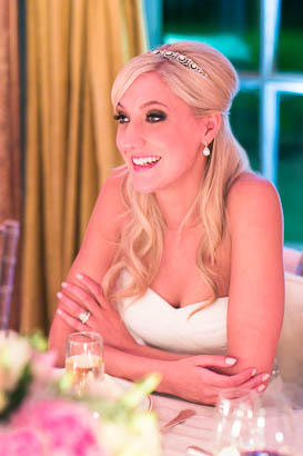 Smiling Bride Seated at Reception