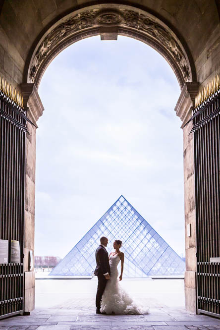 Groom and Bride in Front of Louvre Pyramids
