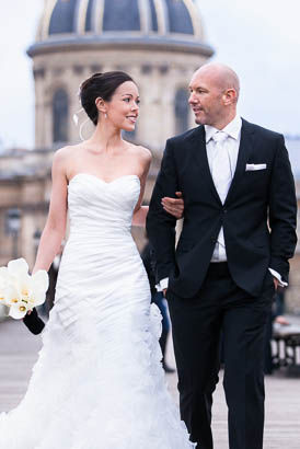 Bride With Bouquet Walks with Groom on Pont des Arts