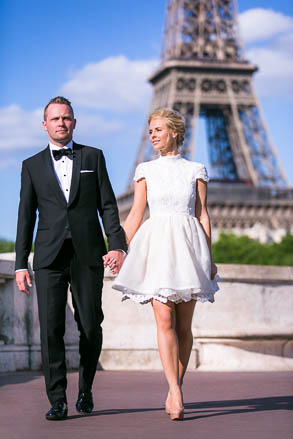 Groom Walks Hand in Hand Near Eiffel Tower