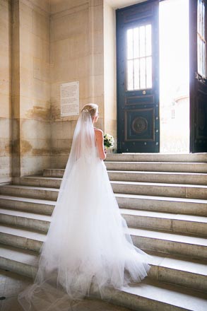 Bride in Sunlight at Stairs
