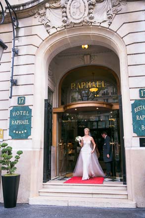 Bride Leaving Arched Door of Paris Hotel