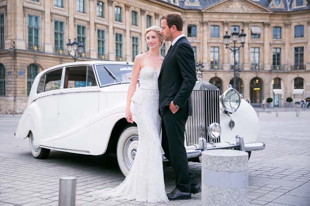 Bride and Groom Stand by Rolls in Paris Square